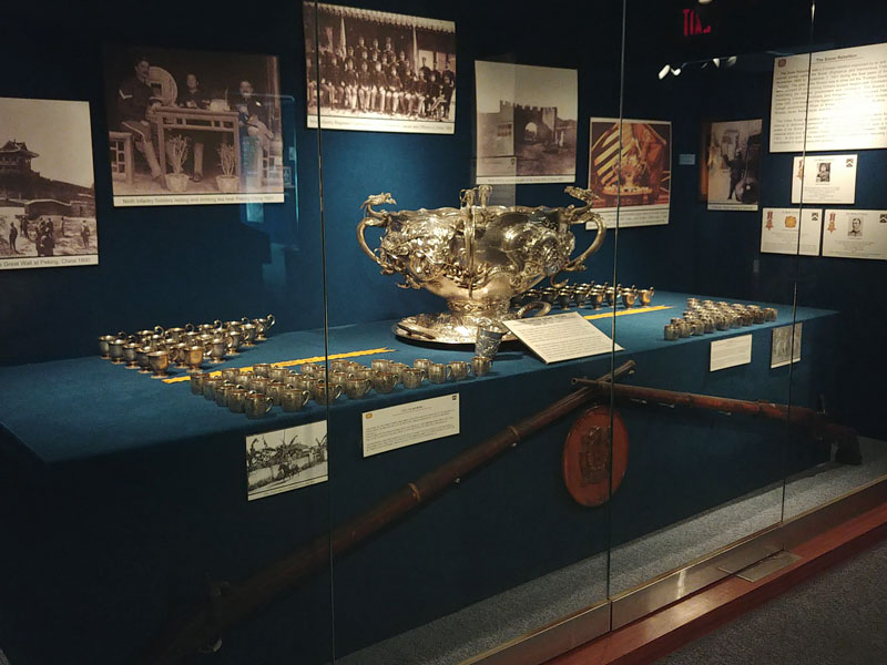 Museum artifacts in glass enclosure at the 2nd Infantry Division Museum.